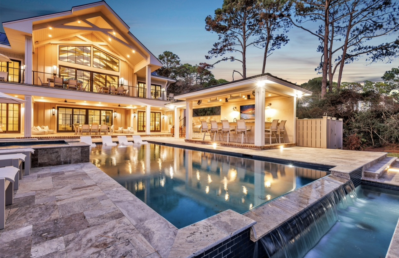 Luxury coastal property exterior at golden hour