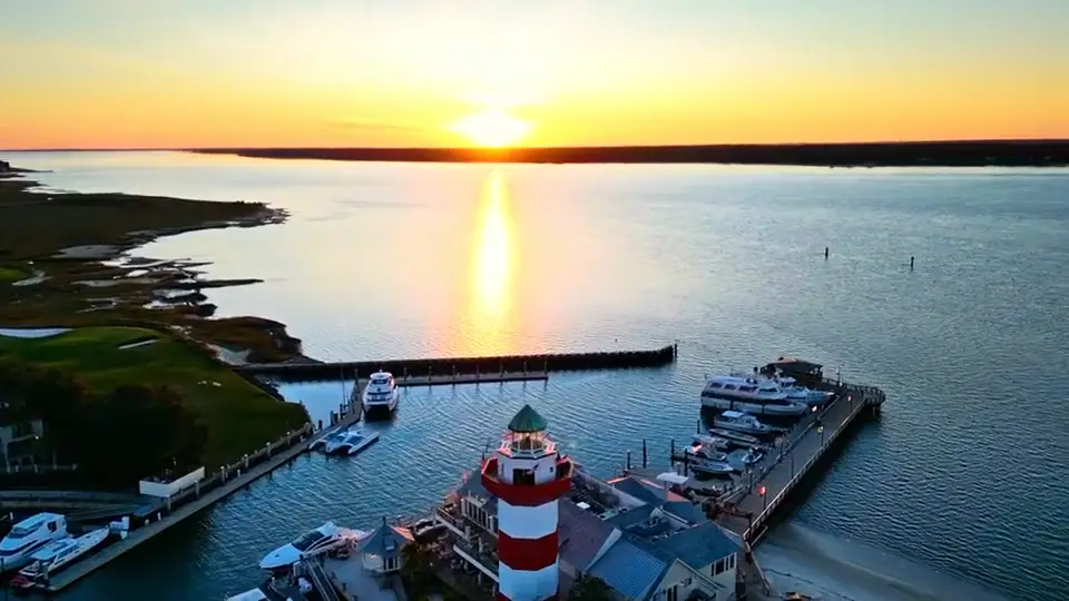 Aerial of the Harbour Town lighthouse at sunset